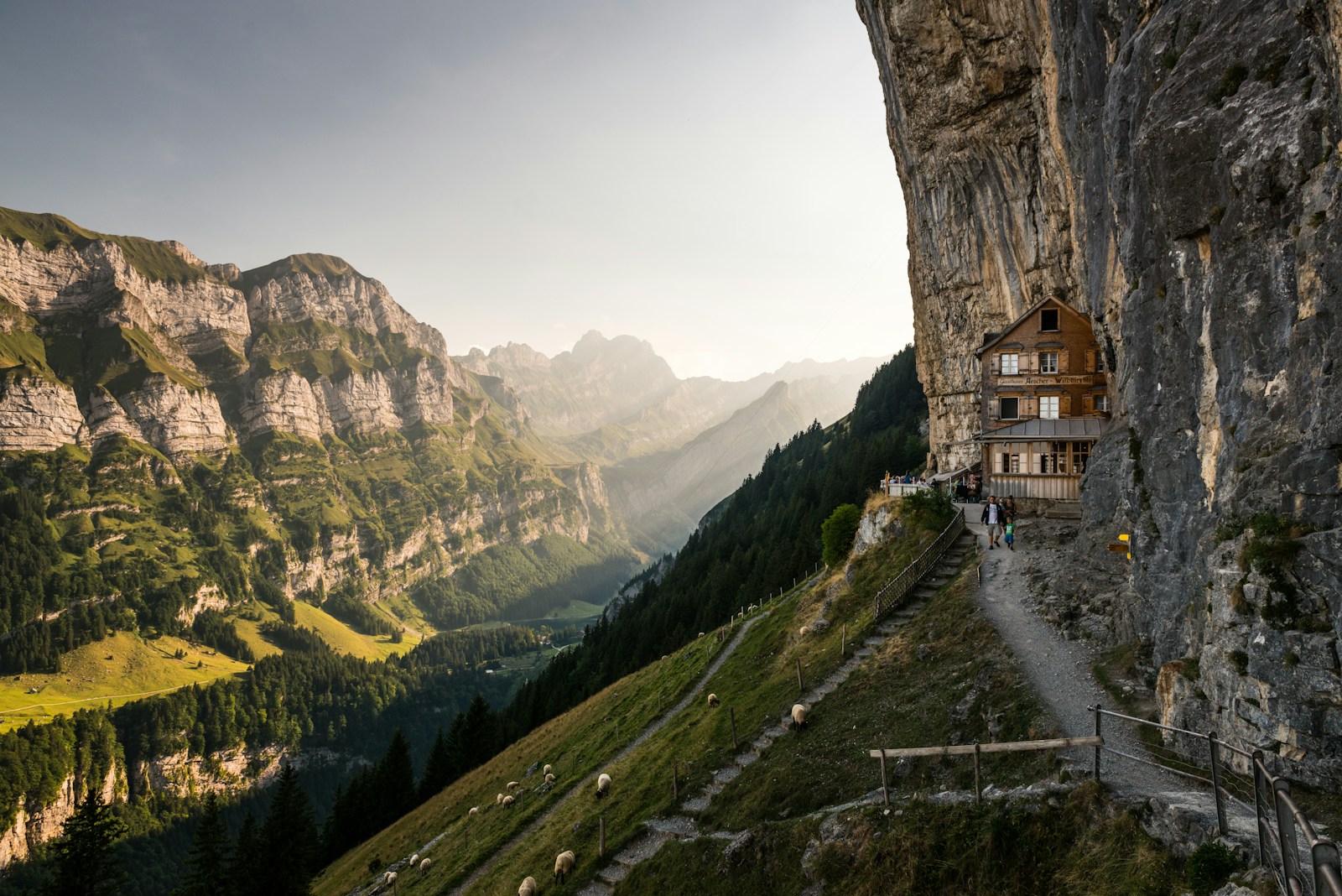 The Äscher cliff guesthouse tucked under the rock face at Ebenalp