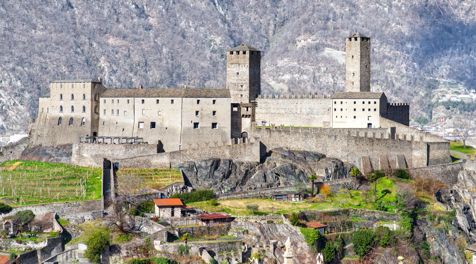 The stone walls and twin towers of Castelgrande up close