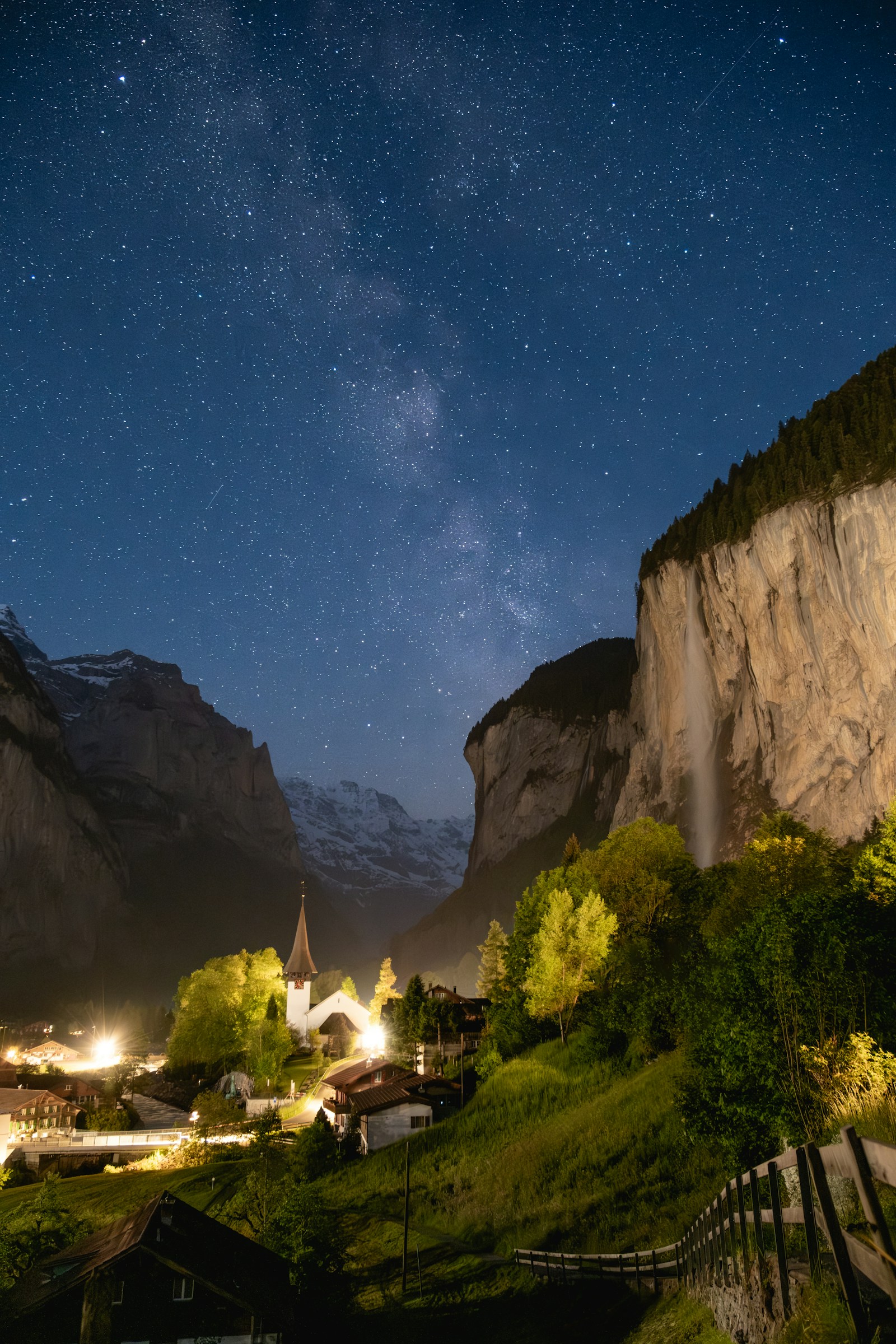 Lauterbrunnen village and waterfall under the Milky Way at night