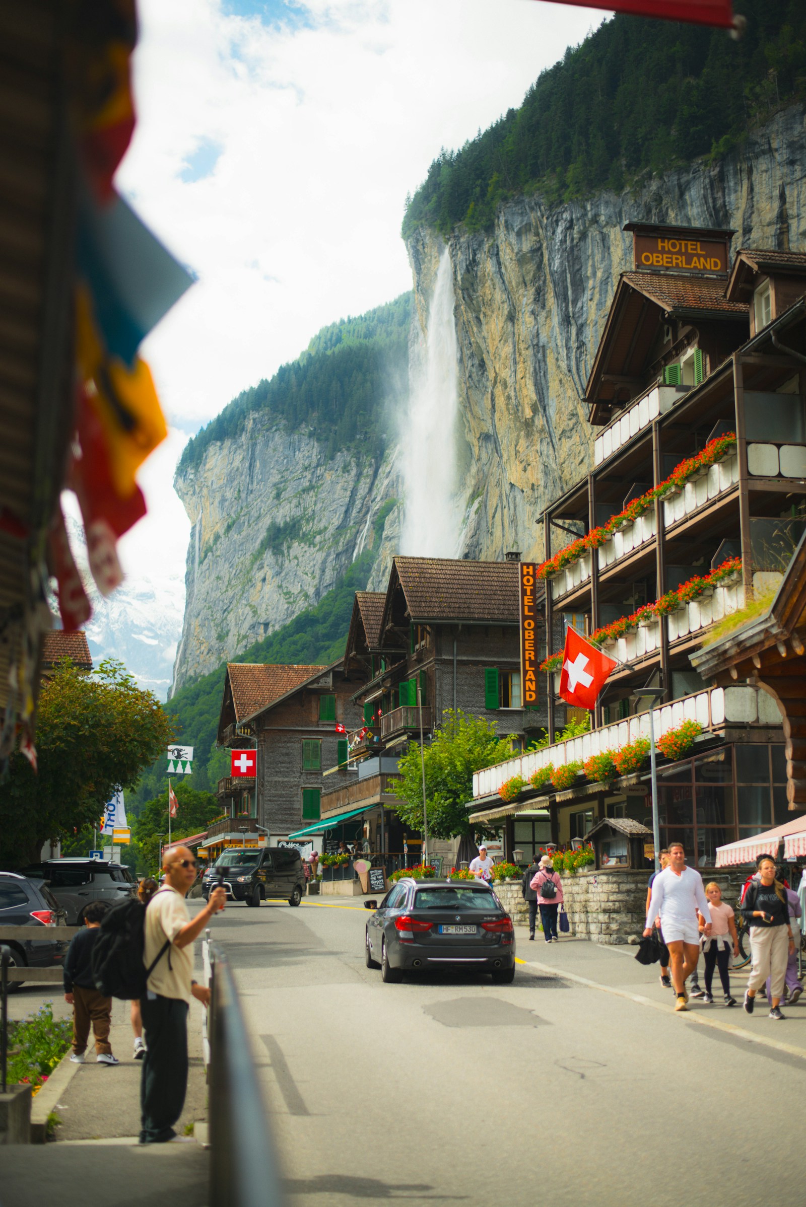 Lauterbrunnen village street with the Staubbach Falls behind